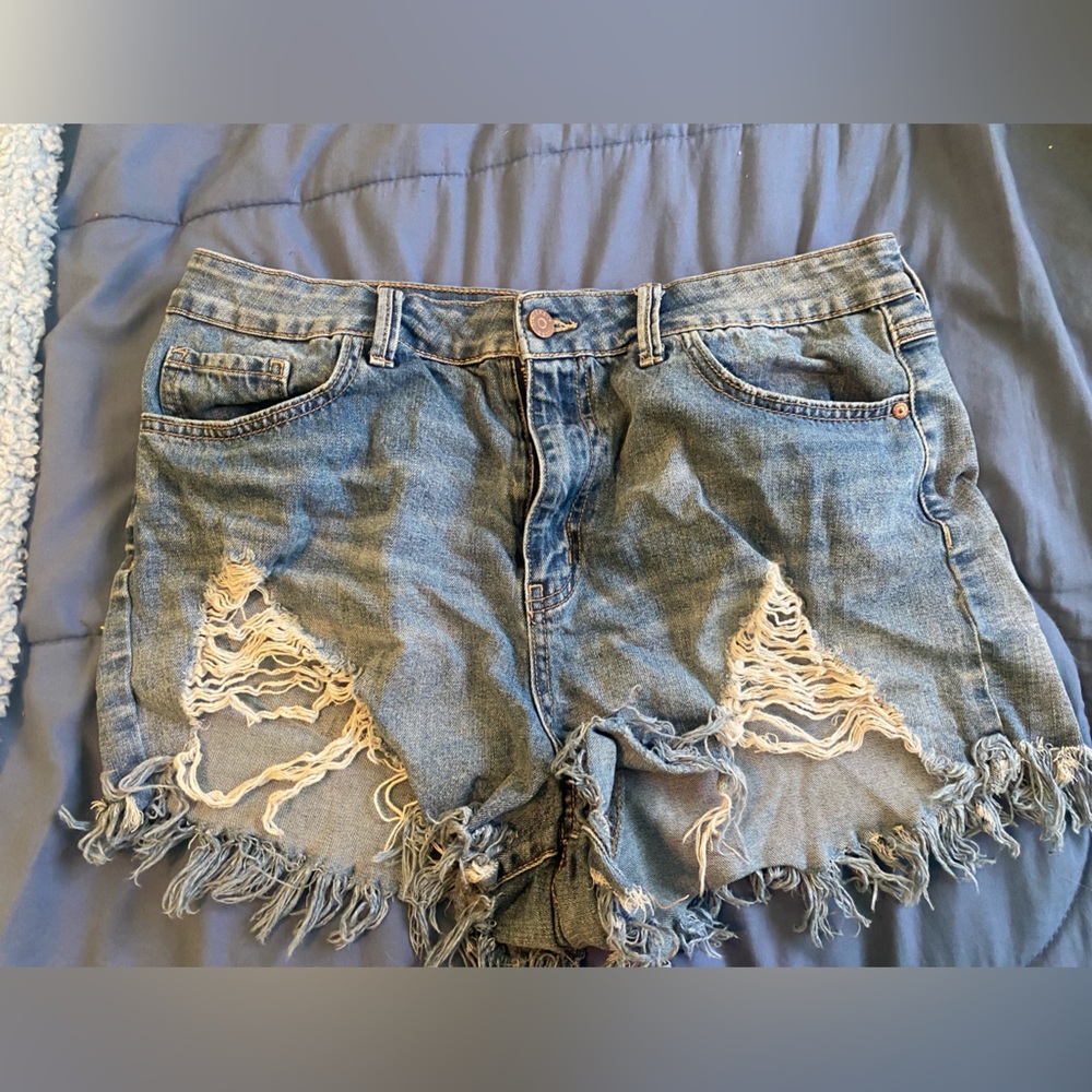 ripped blue shorts